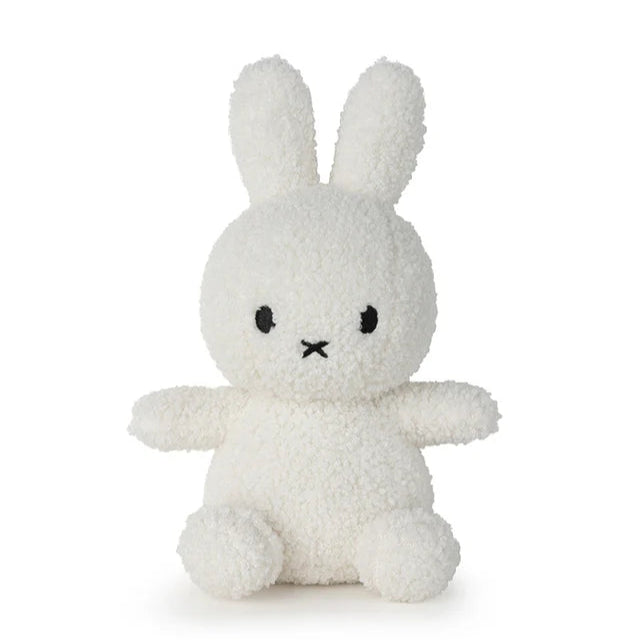White plush bunny toy on a white background