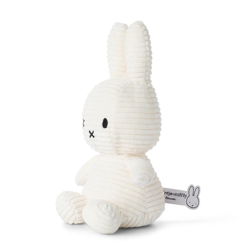 Cream-colored corduroy Miffy plush toy in a seated position.  Simple black embroidered facial features.