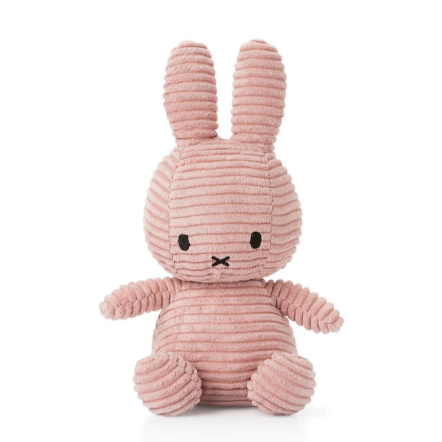 Pink plush bunny toy on a white background