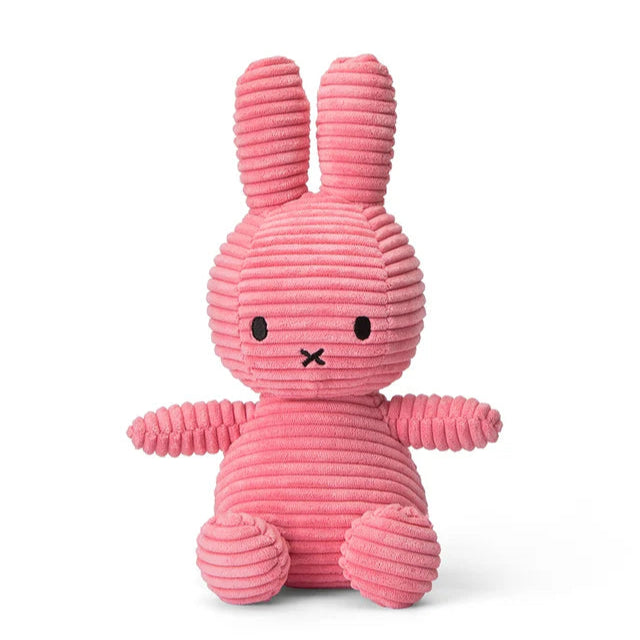 Pink corduroy Miffy plush toy sitting down.