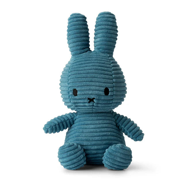 Teal corduroy Miffy plush toy sitting down.  The toy has simple embroidered facial features.