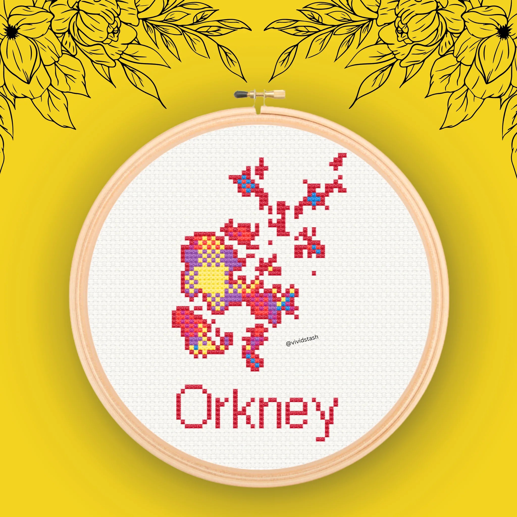 Cross-stitch embroidery of Orkney islands in multicolored pixel art style, displayed in a wooden hoop.