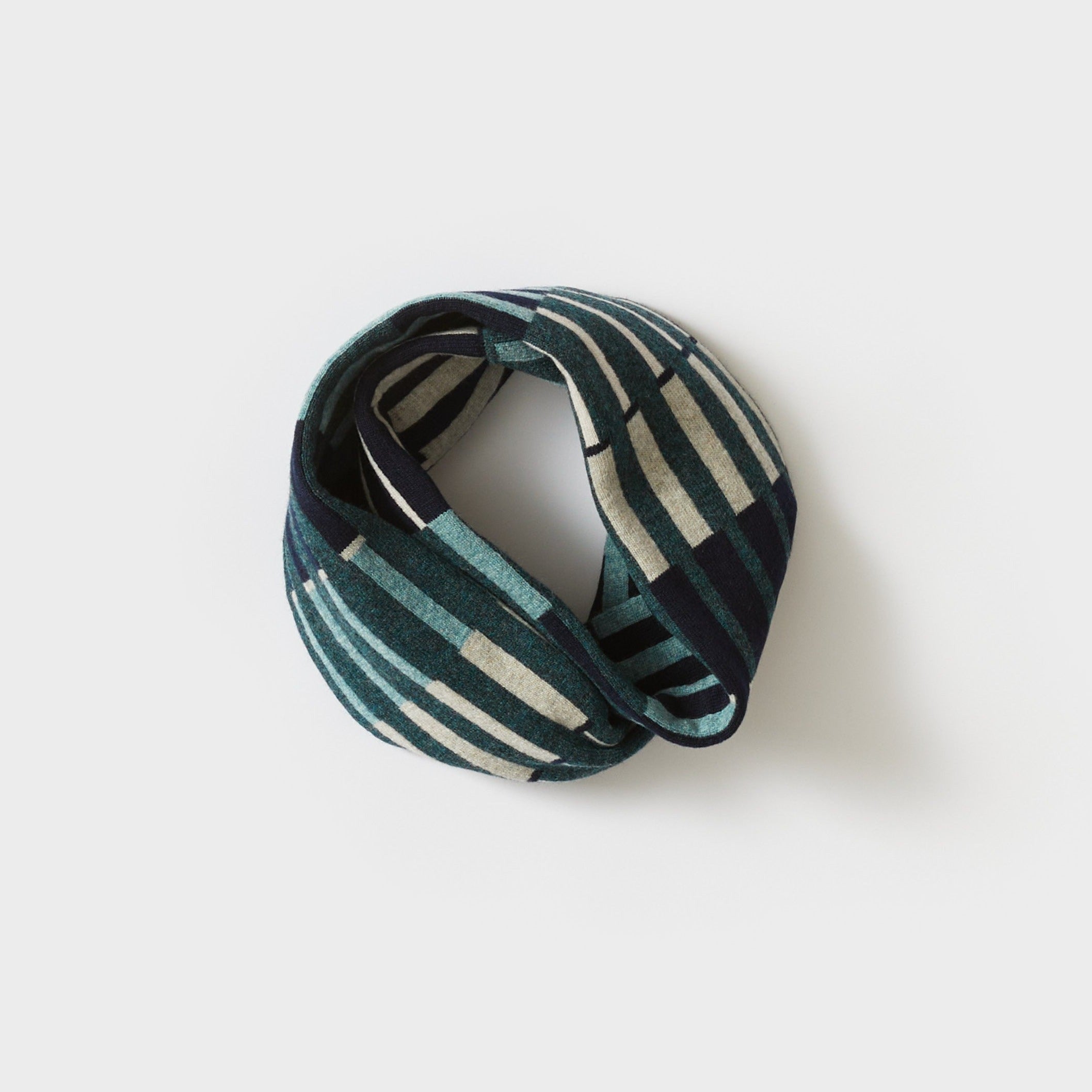 Teal, navy, and cream striped knitted infinity scarf.