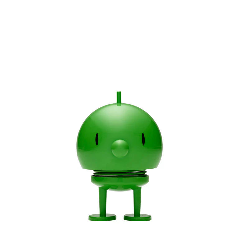 Green robot toy on a white background