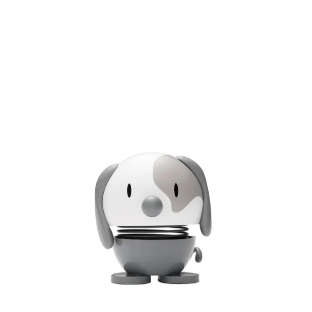 Small dog-shaped object on a white background