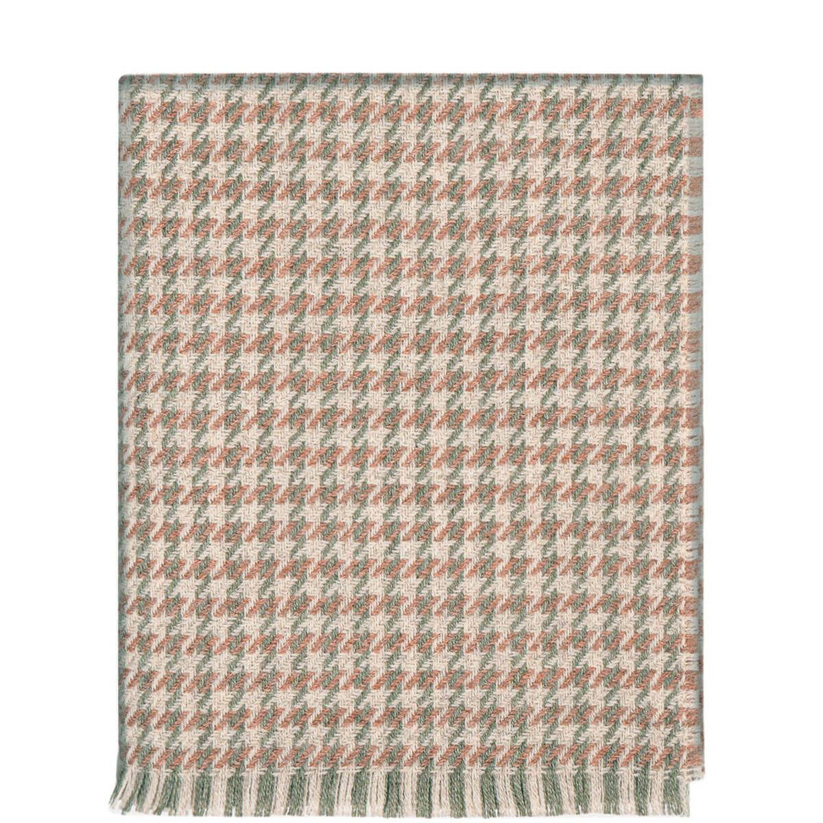 Woven throw blanket in a neutral-toned houndstooth pattern with a fringed edge.