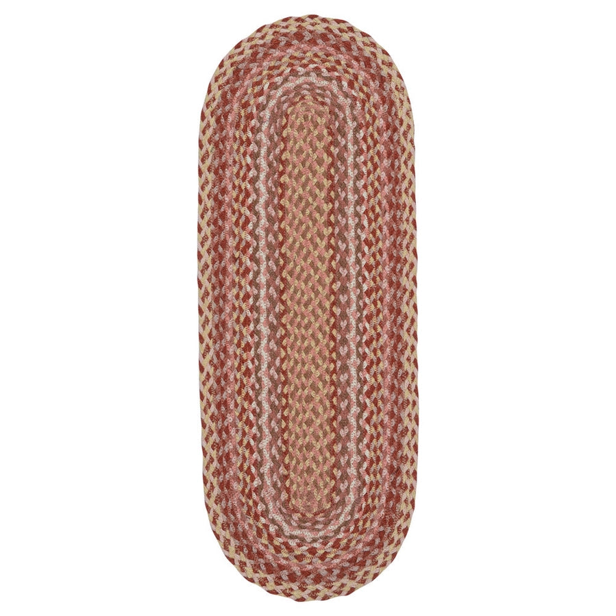 An oval braided area rug with a pattern of rust red, beige, and cream yarns, shown flat against a solid white background.