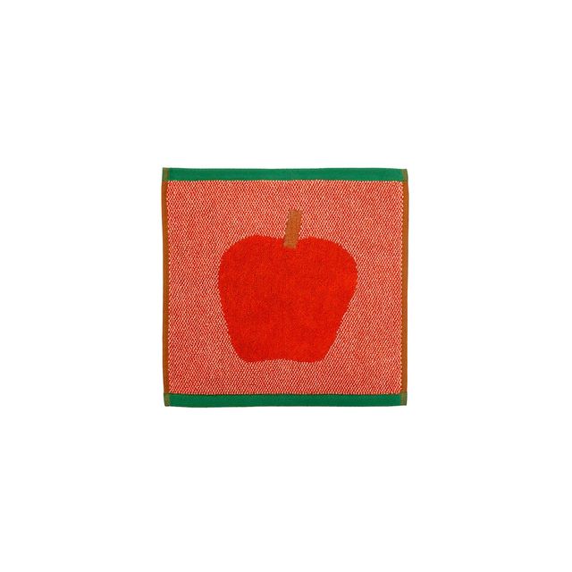 A square woven textile featuring a large red apple motif in the center, bordered by green trim on two sides and a thin orange line, shown on a plain white background.