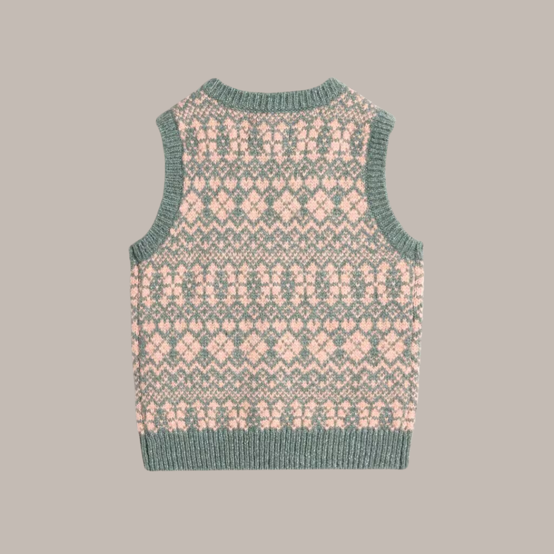 Green and pink sleeveless knitted sweater vest with a geometric pattern.