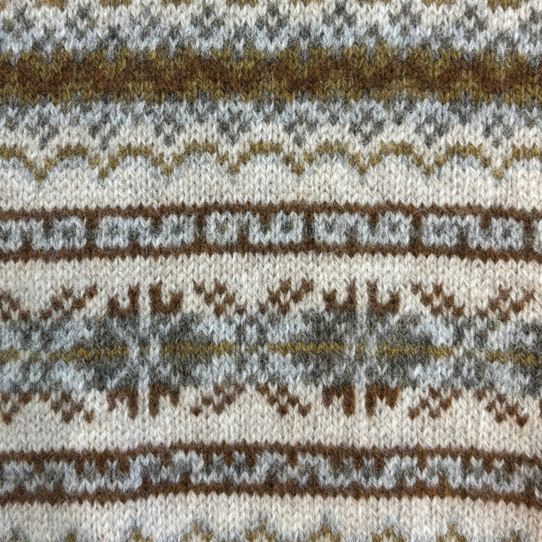 Fair isle knit fabric with brown, gray, and off-white repeating pattern.