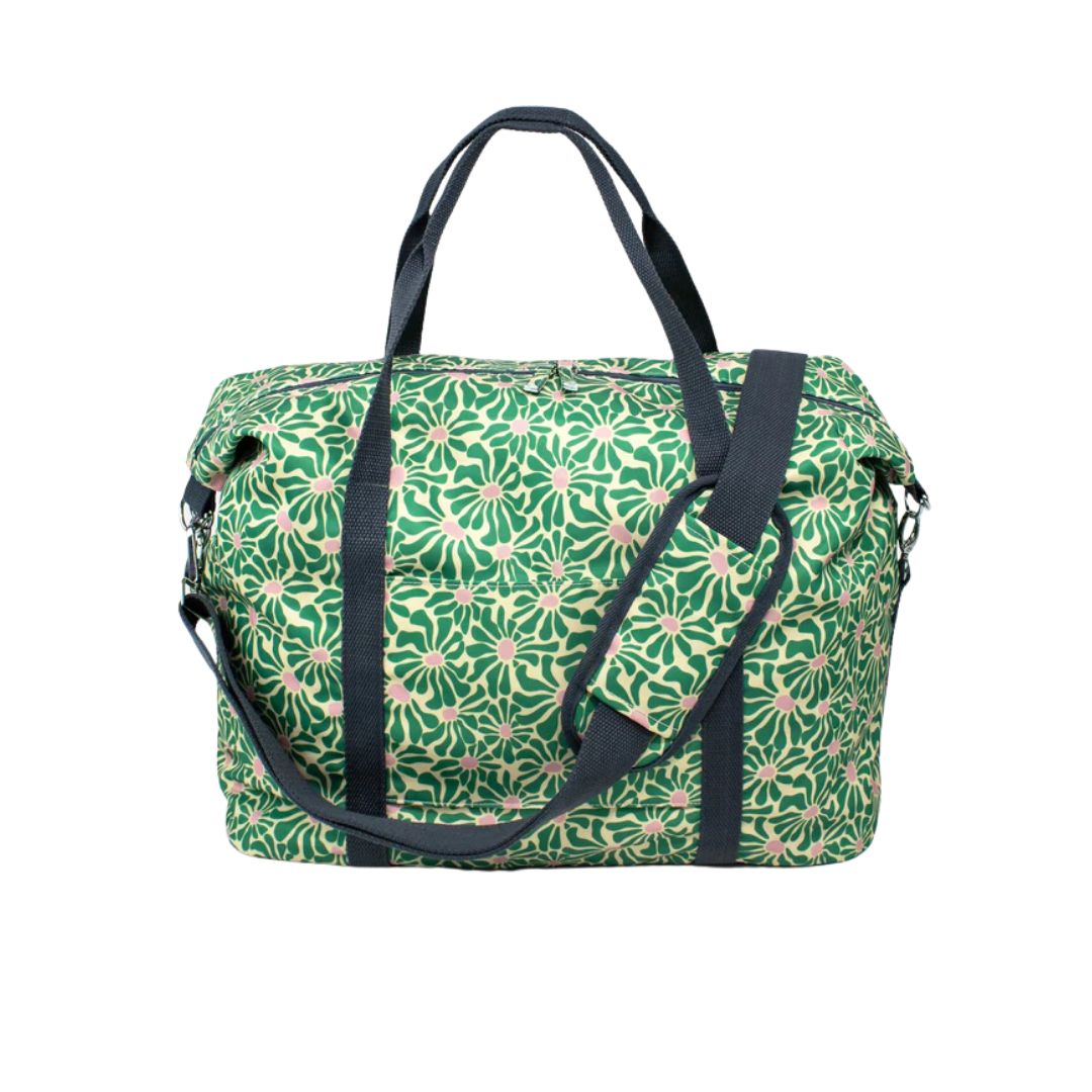 Green and beige floral-patterned duffel bag with dark gray handles and shoulder strap.