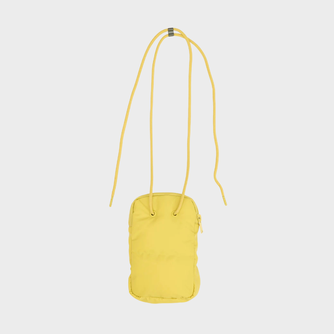 Yellow crossbody bag on a light gray background