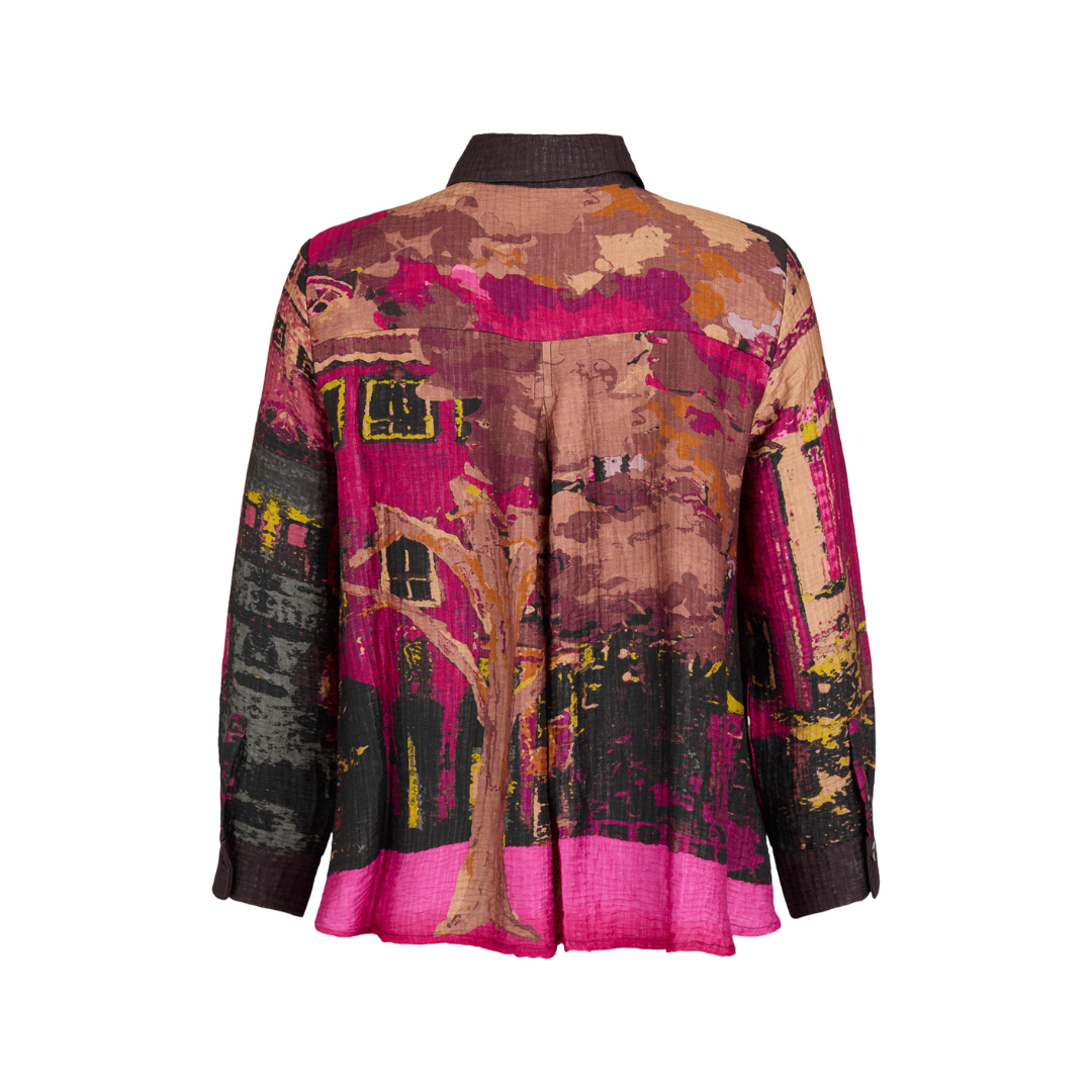 A women's long-sleeve blouse shown from the back, featuring a vibrant abstract landscape print with pink, brown, black, and yellow tones.