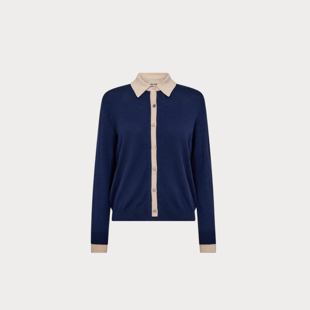 Navy blue long-sleeve shirt with beige collar and cuffs on a light gray background