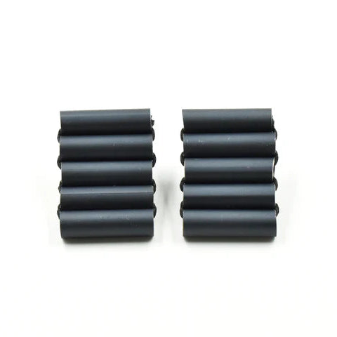 Two black cylindrical rubber bushings on a white background