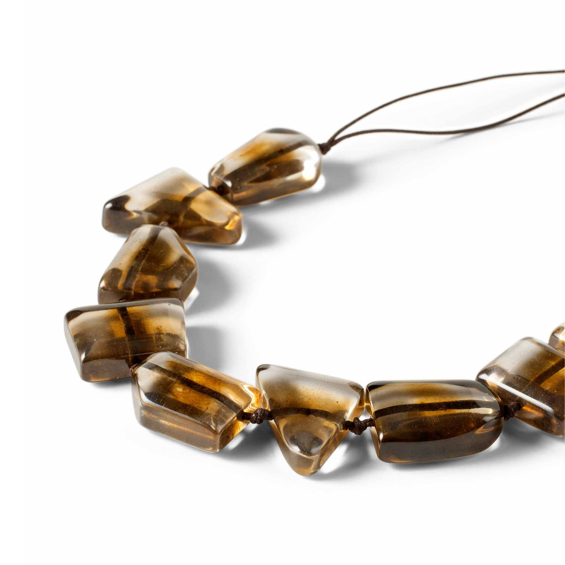 Brown beaded necklace on a white background