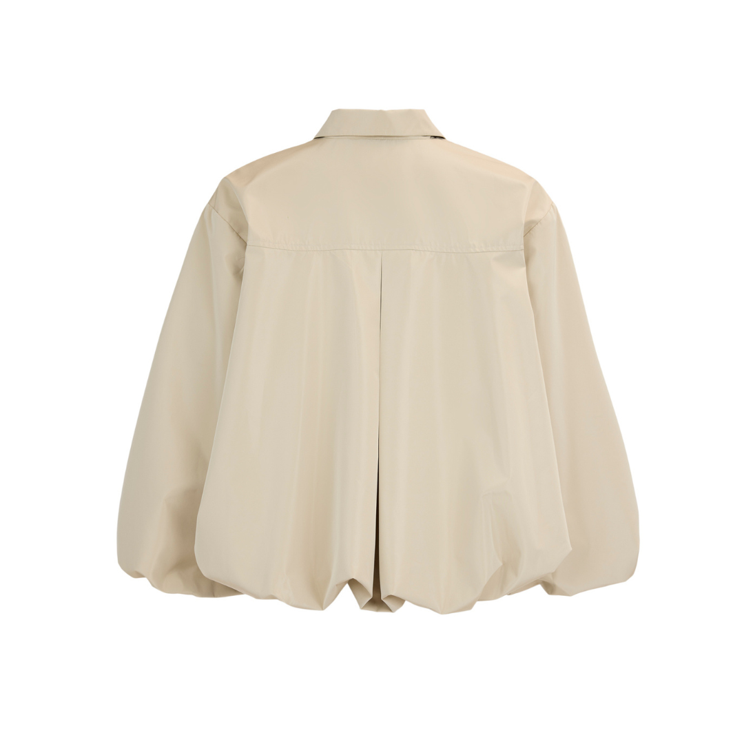 Beige blouse on a white background