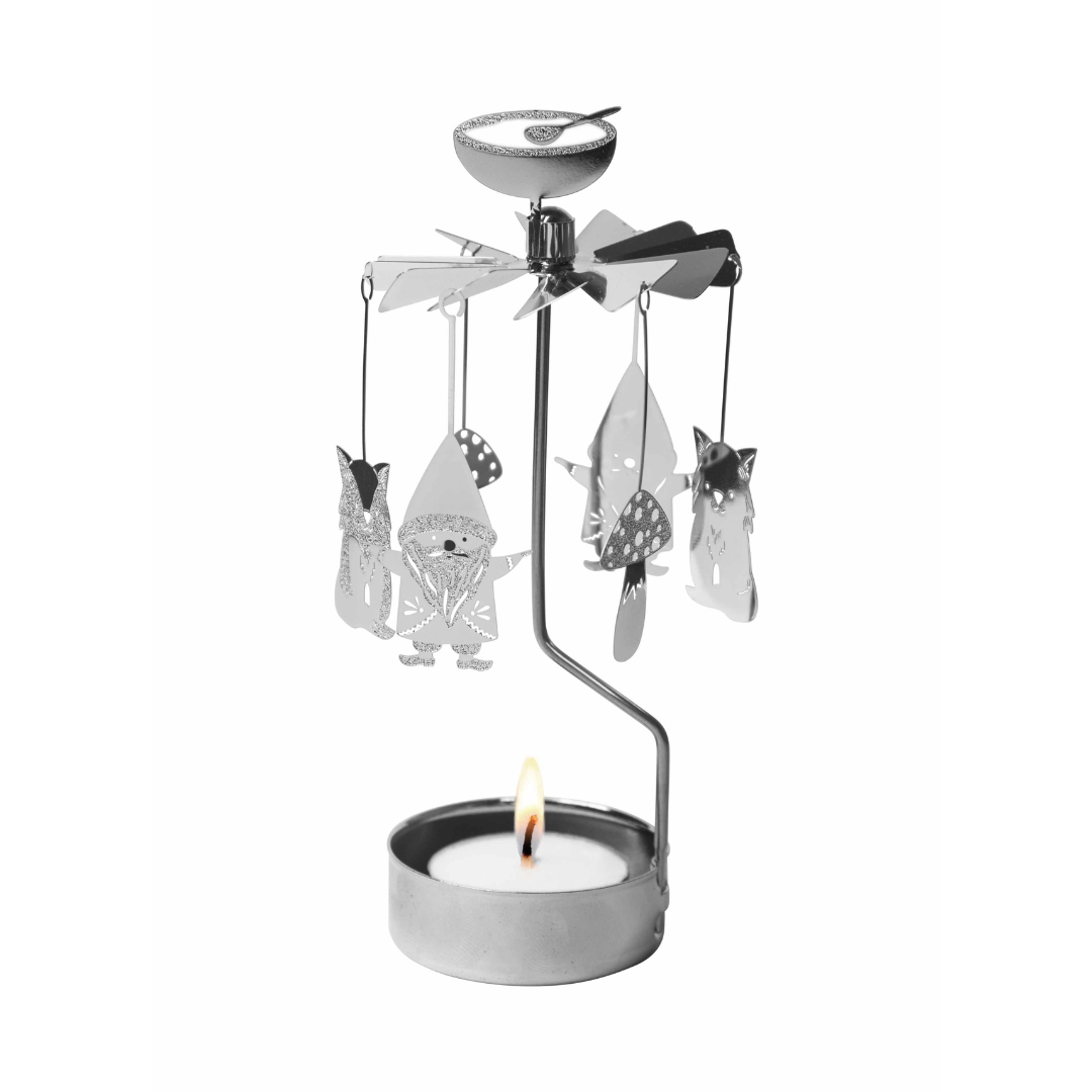 Decorative candle holder with spinning animal figures on a white background