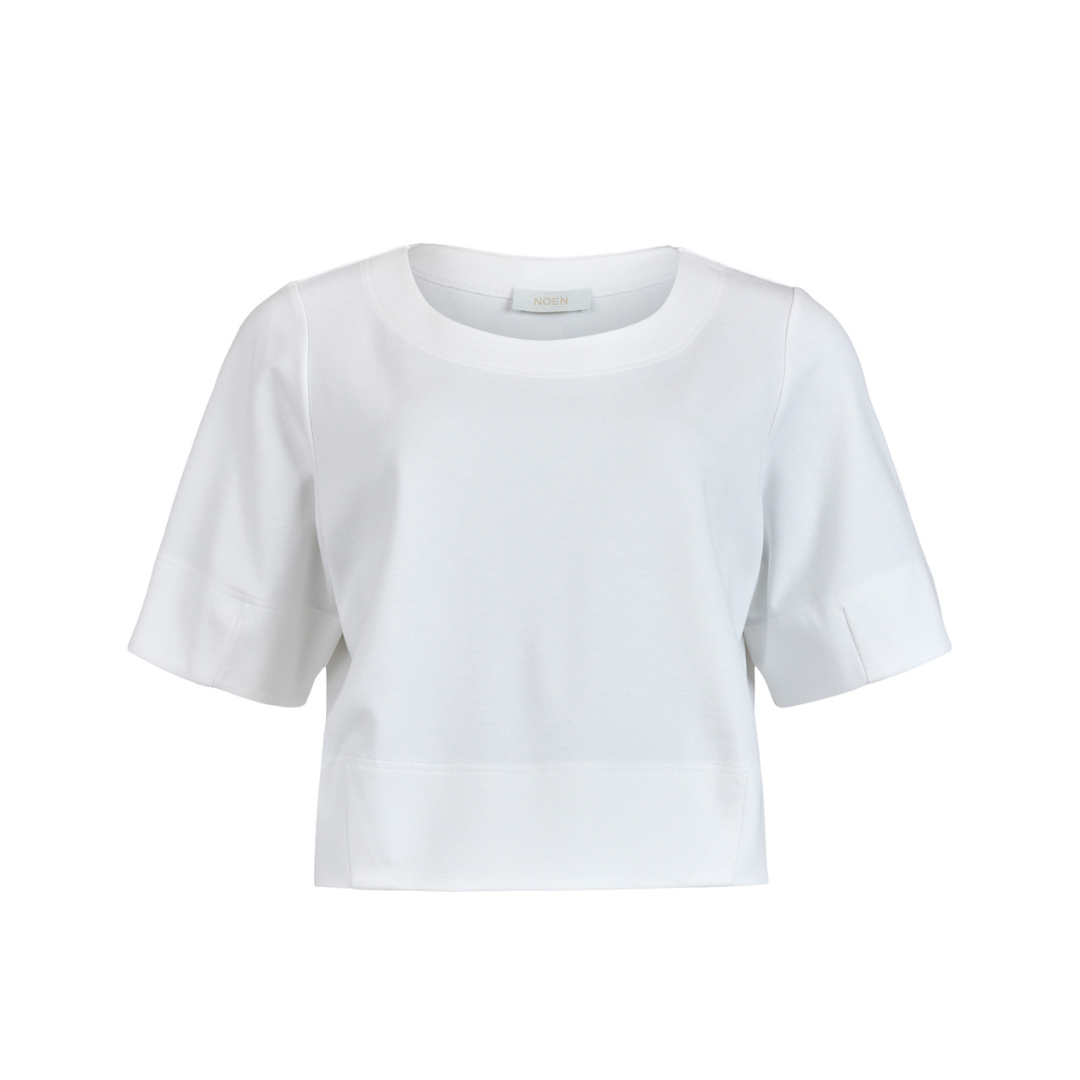 White cropped short-sleeve top with a round neckline.