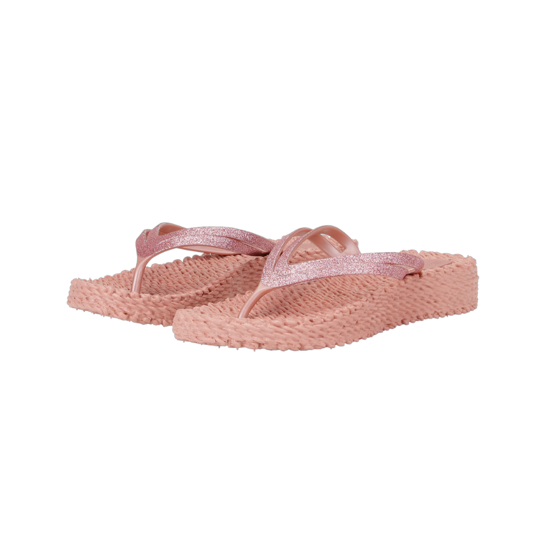 Pair of rose gold glitter flip-flops with textured soles.