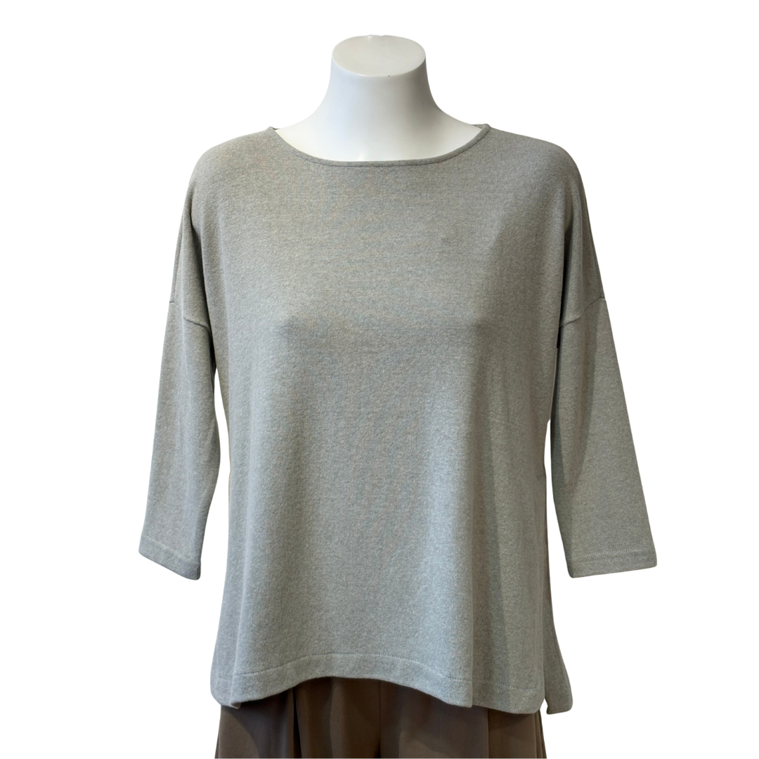 Gray sweater on a mannequin against a white background