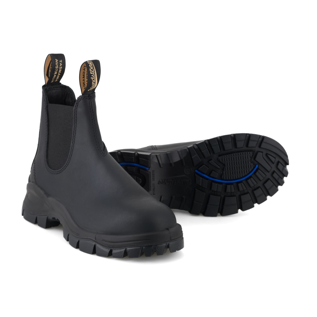 Pair of black Blundstone Chelsea boots with a rugged outsole.
