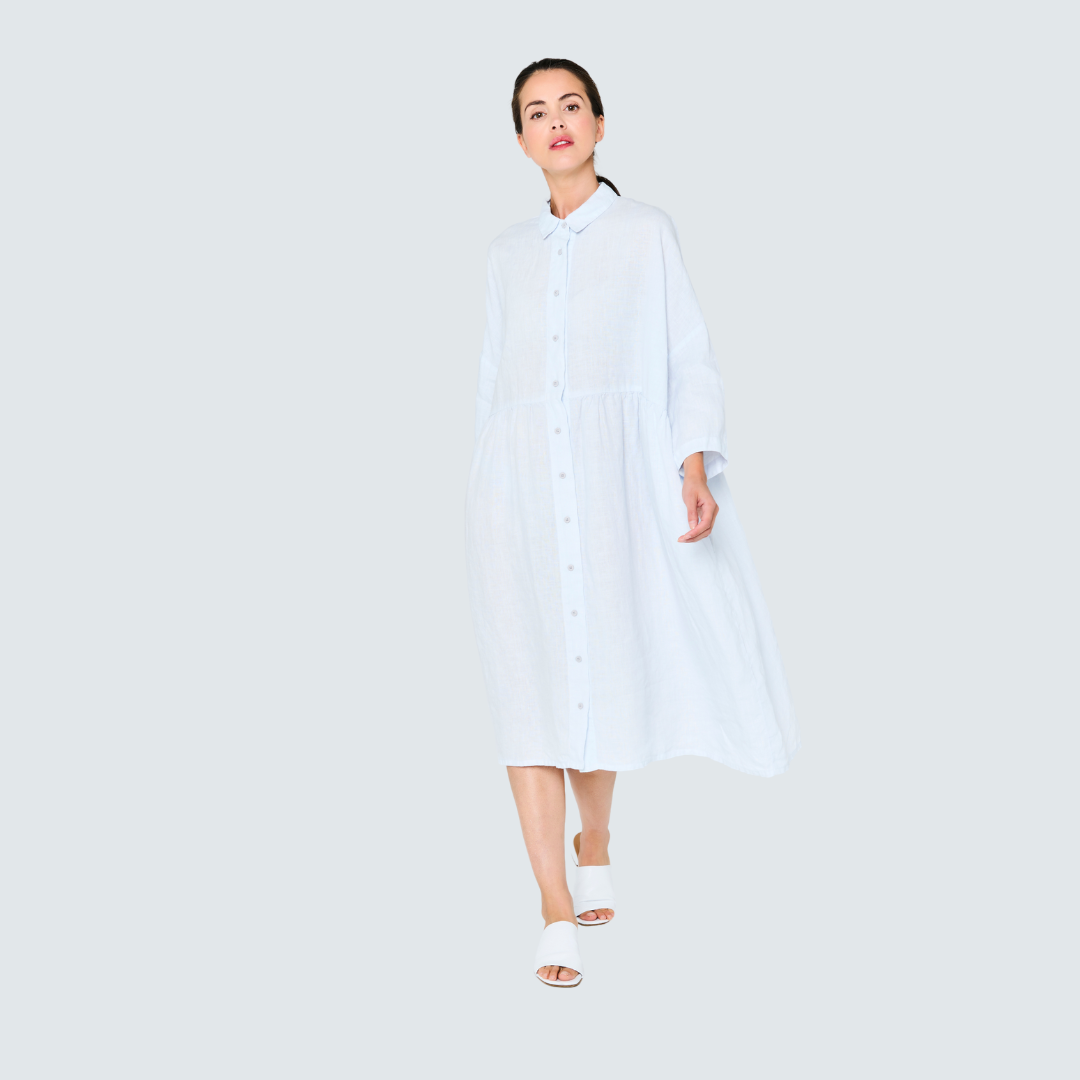 Light blue linen shirt dress with button front and midi length.