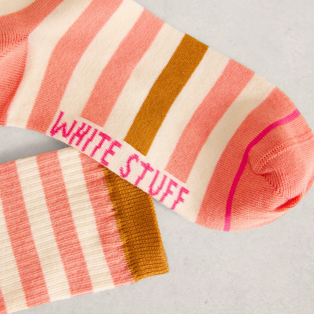 Striped socks with 'White Stuff' branding on a light gray background