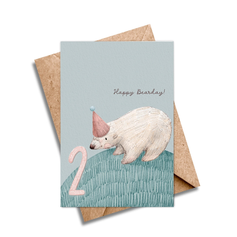 Second birthday card featuring a polar bear wearing a party hat, next to the number two.