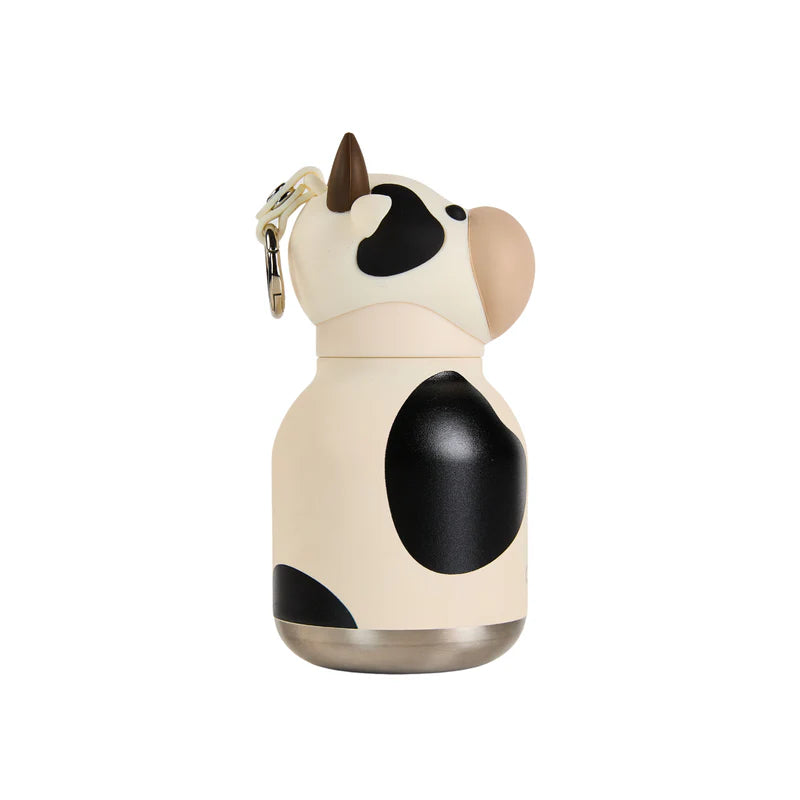 Cow-shaped water bottle with a keychain on a white background