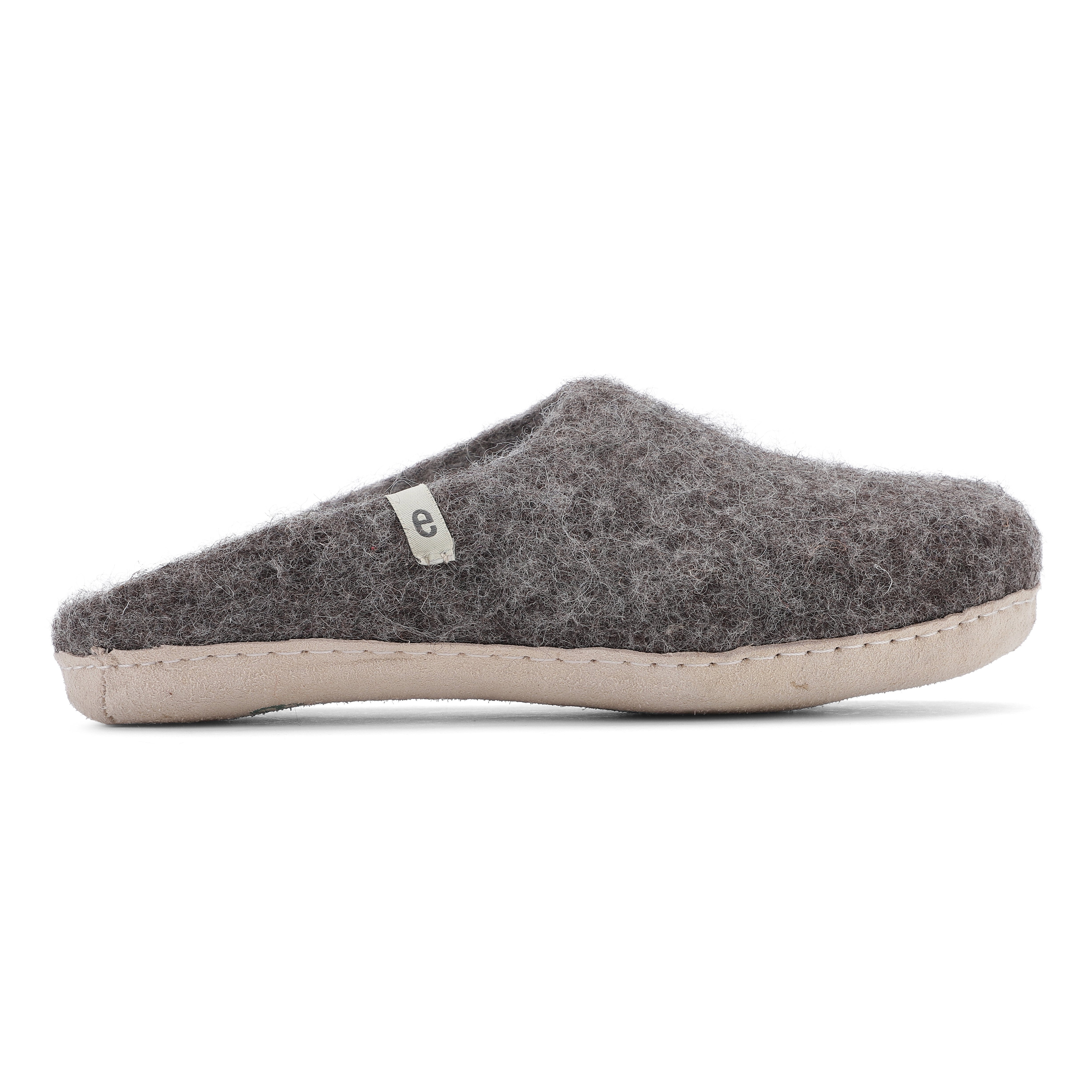 Dark gray wool felt slipper with a light beige sole.  The slipper is a mule style and features a small, light-colored label.