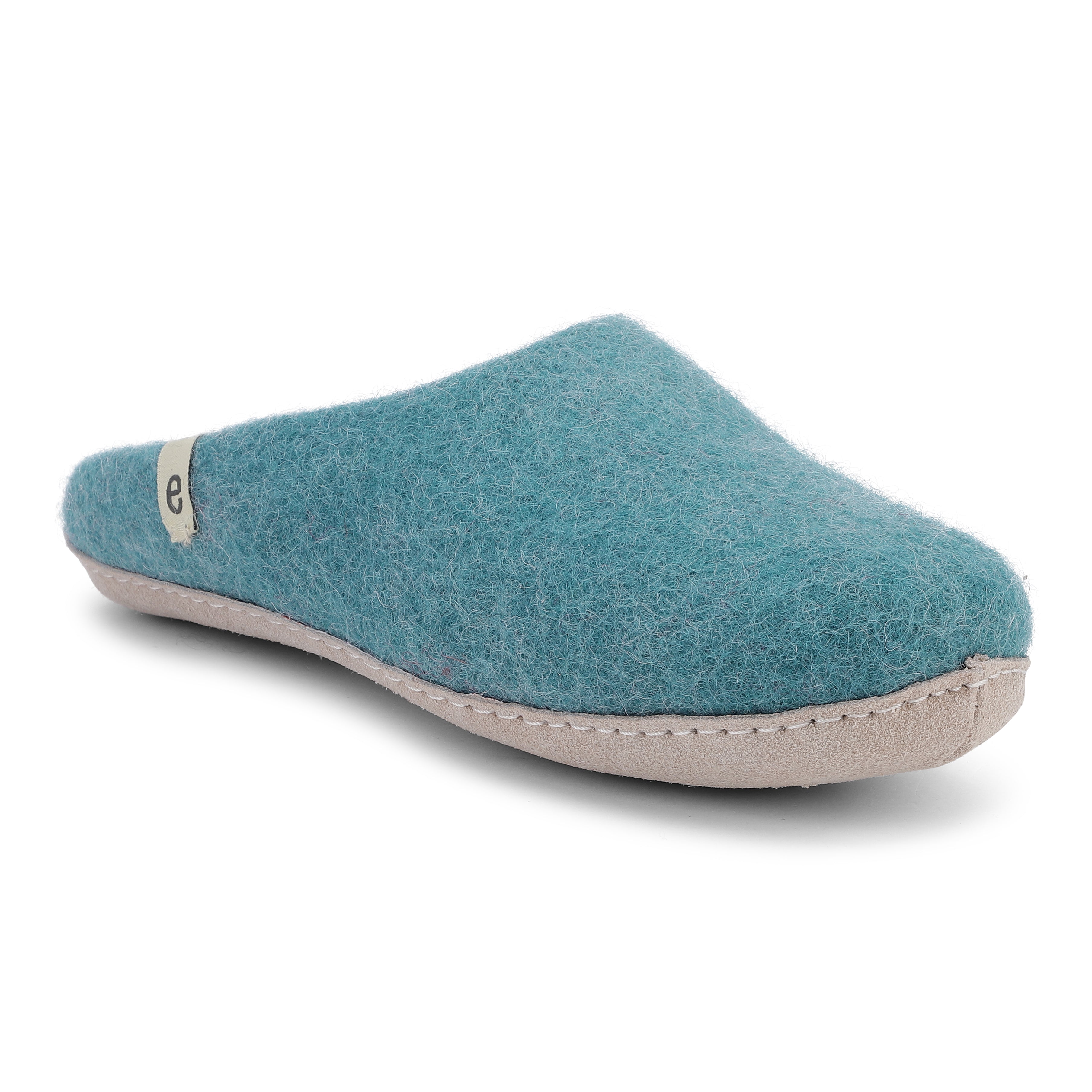 Teal felt slipper with a beige sole.  The slipper has a simple design and a small label on the side.