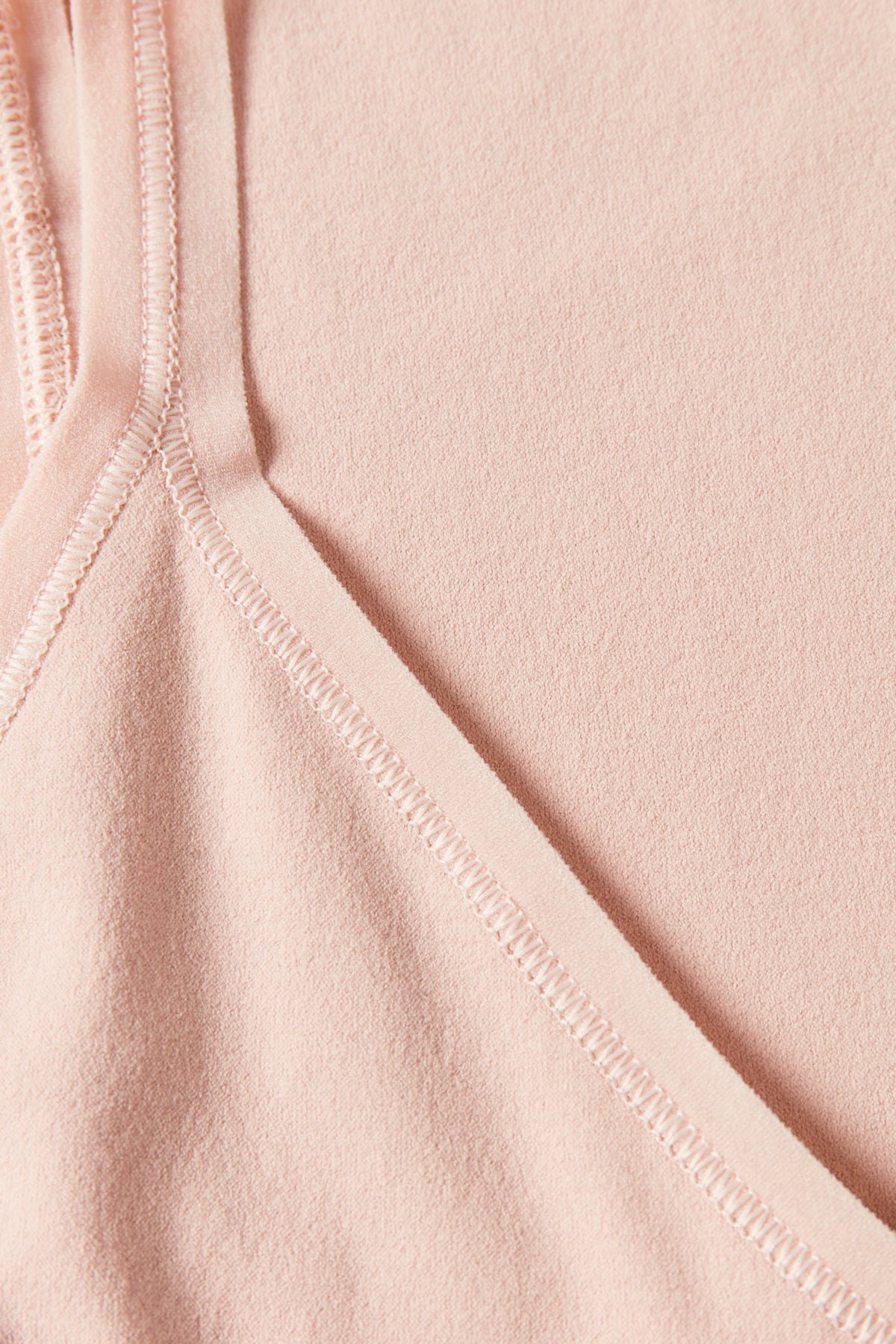 Close-up of a pink fabric with stitching details