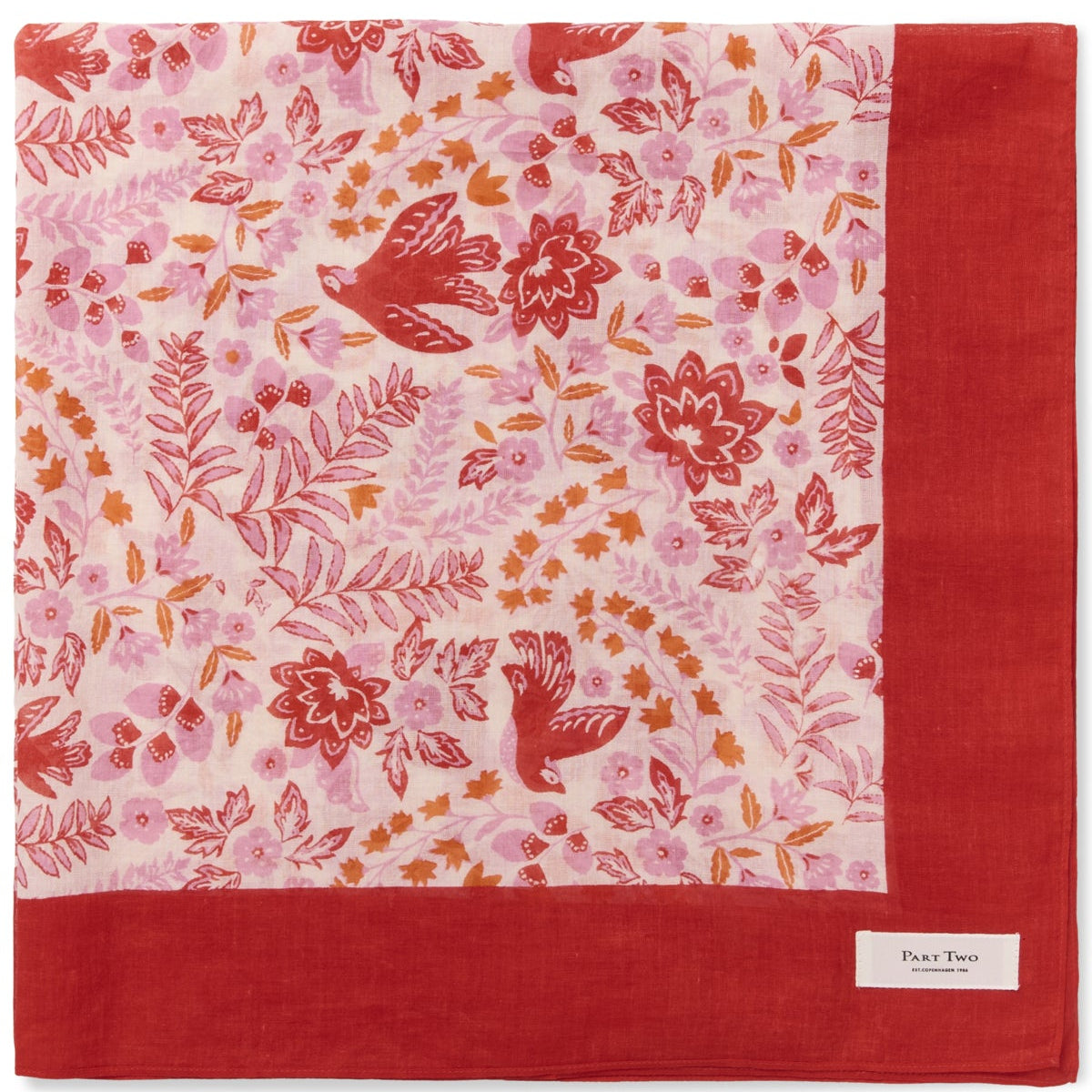 Floral patterned fabric with red border on a white background