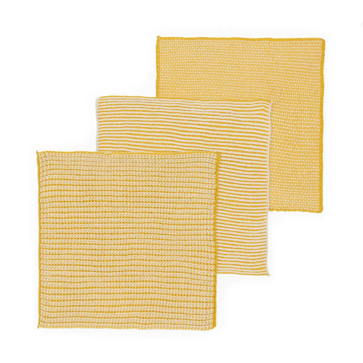 Three yellow textured dishcloths on a white background