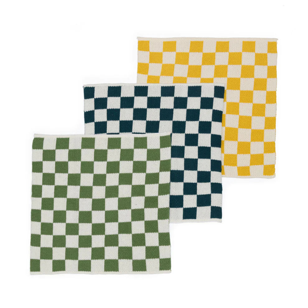 Three checkered fabric swatches in olive green, navy, and gold.  Each swatch features a cream-colored background.