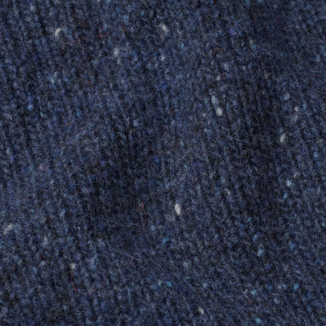 Close-up of a textured dark blue fabric surface