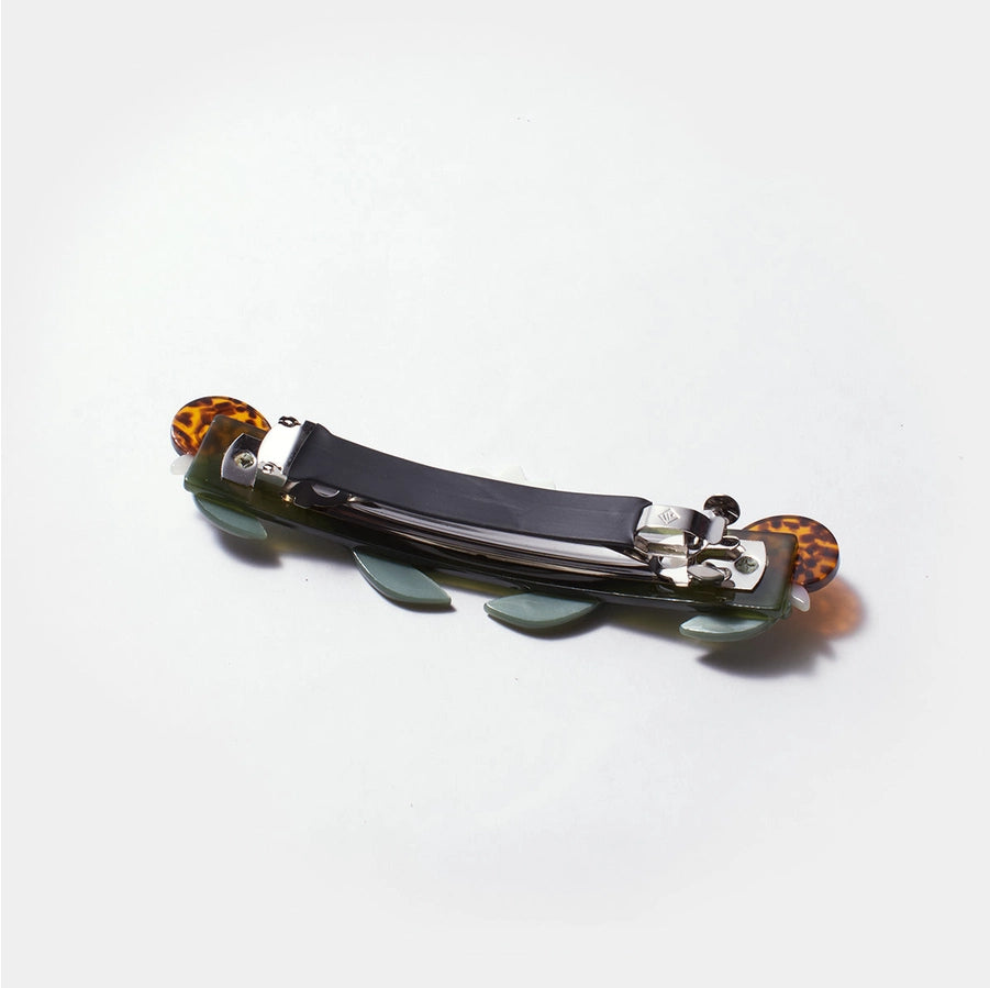 Hair clip with tortoiseshell accents on a white background