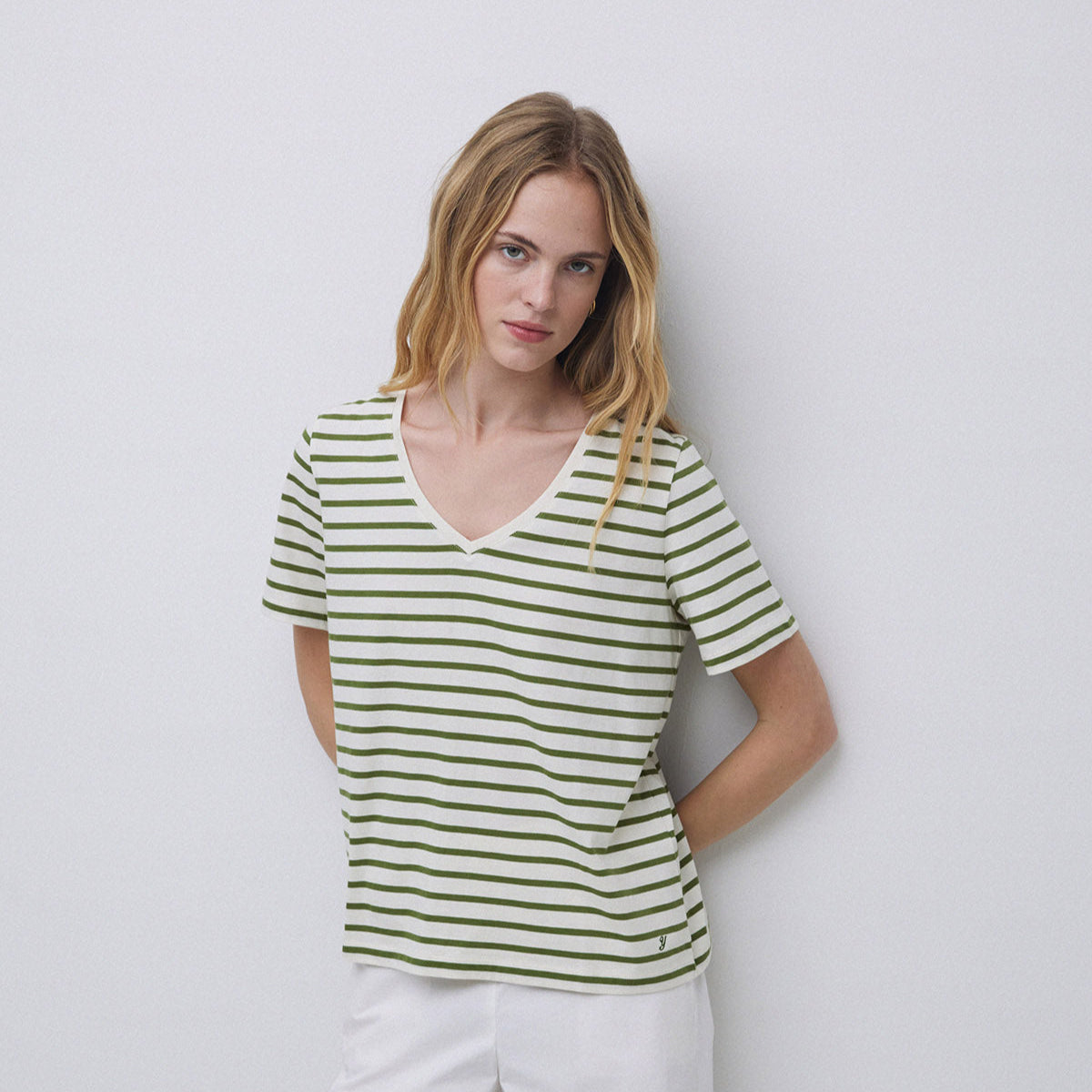 Women's short-sleeve V-neck t-shirt with horizontal olive green and white stripes.