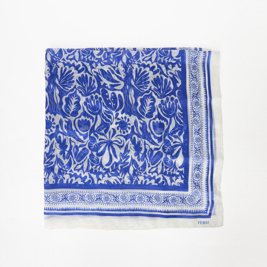 silk square scarf with intricated blue and white floral design with detailed designed border. 