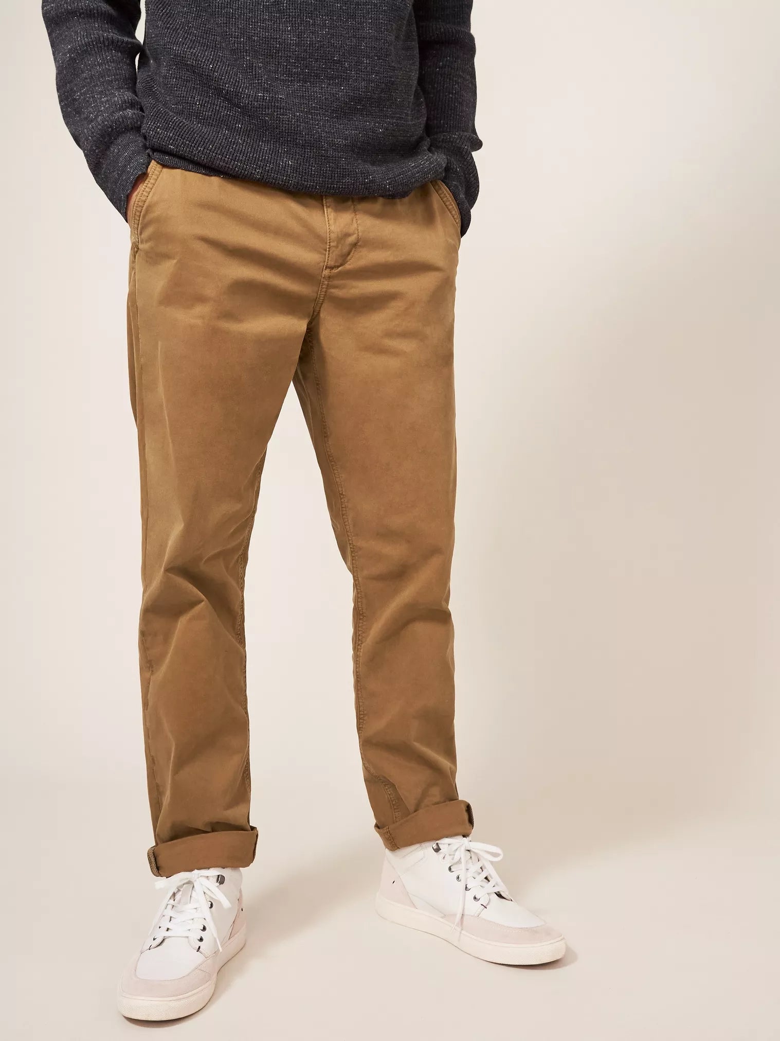 Brown cotton twill pants, straight leg, cuffed at the ankle.