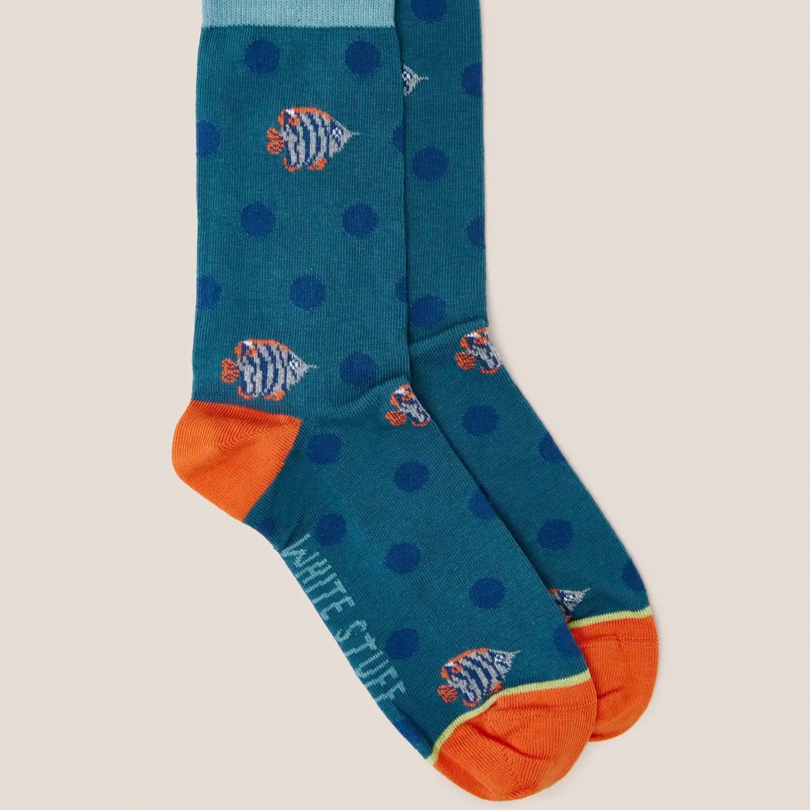 Teal ankle socks with orange cuffs, featuring a repeating pattern of dark blue polka dots and stylized fish.