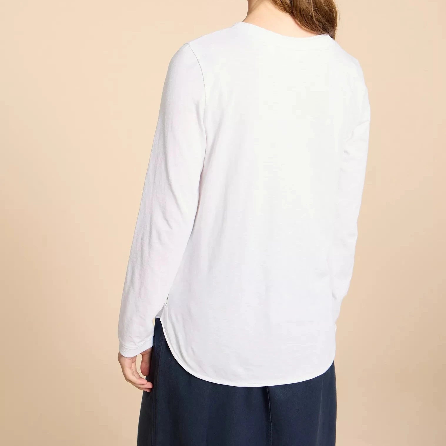 White long-sleeve curved hem t-shirt.