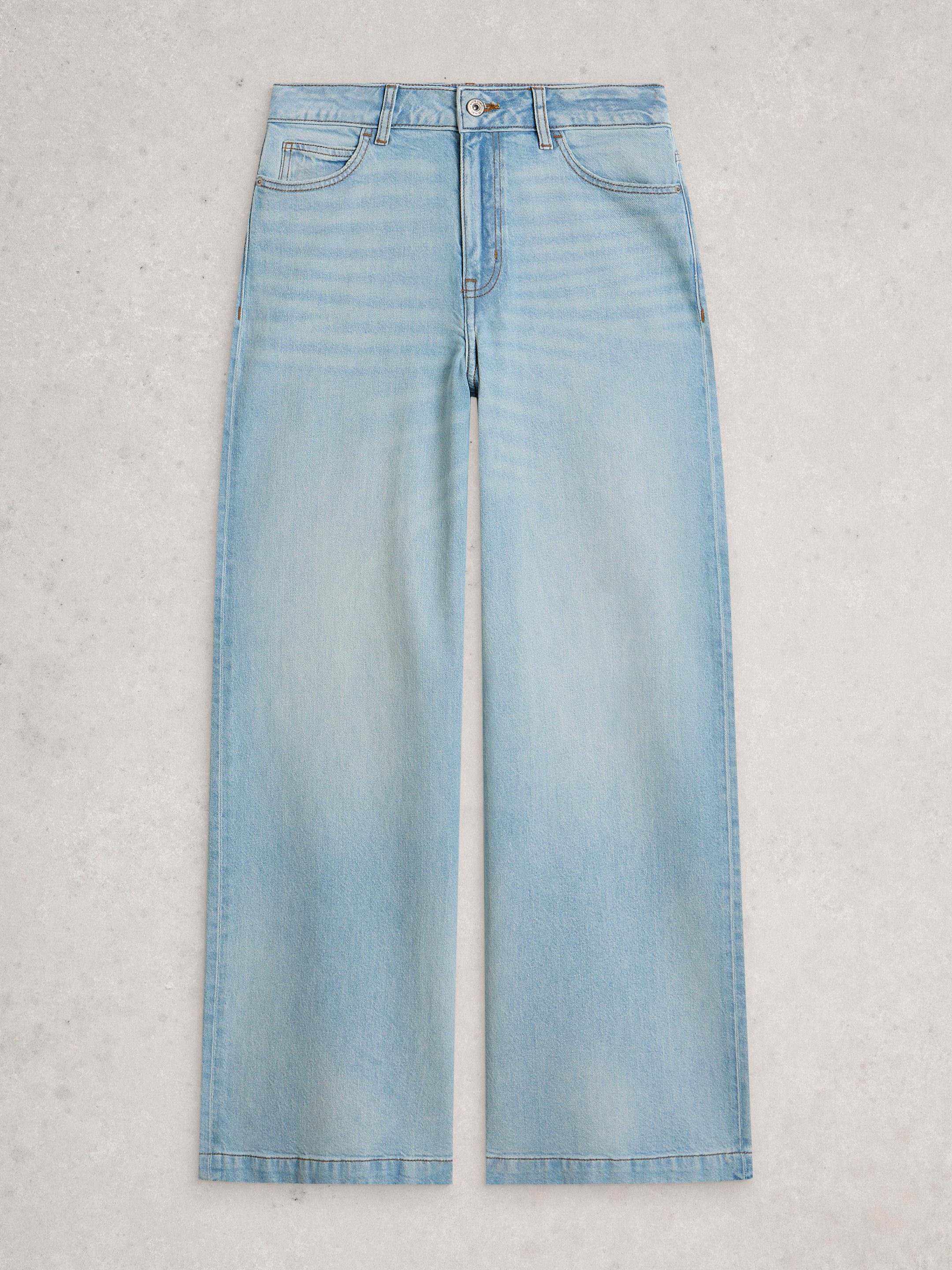 Light blue jeans on a light gray background