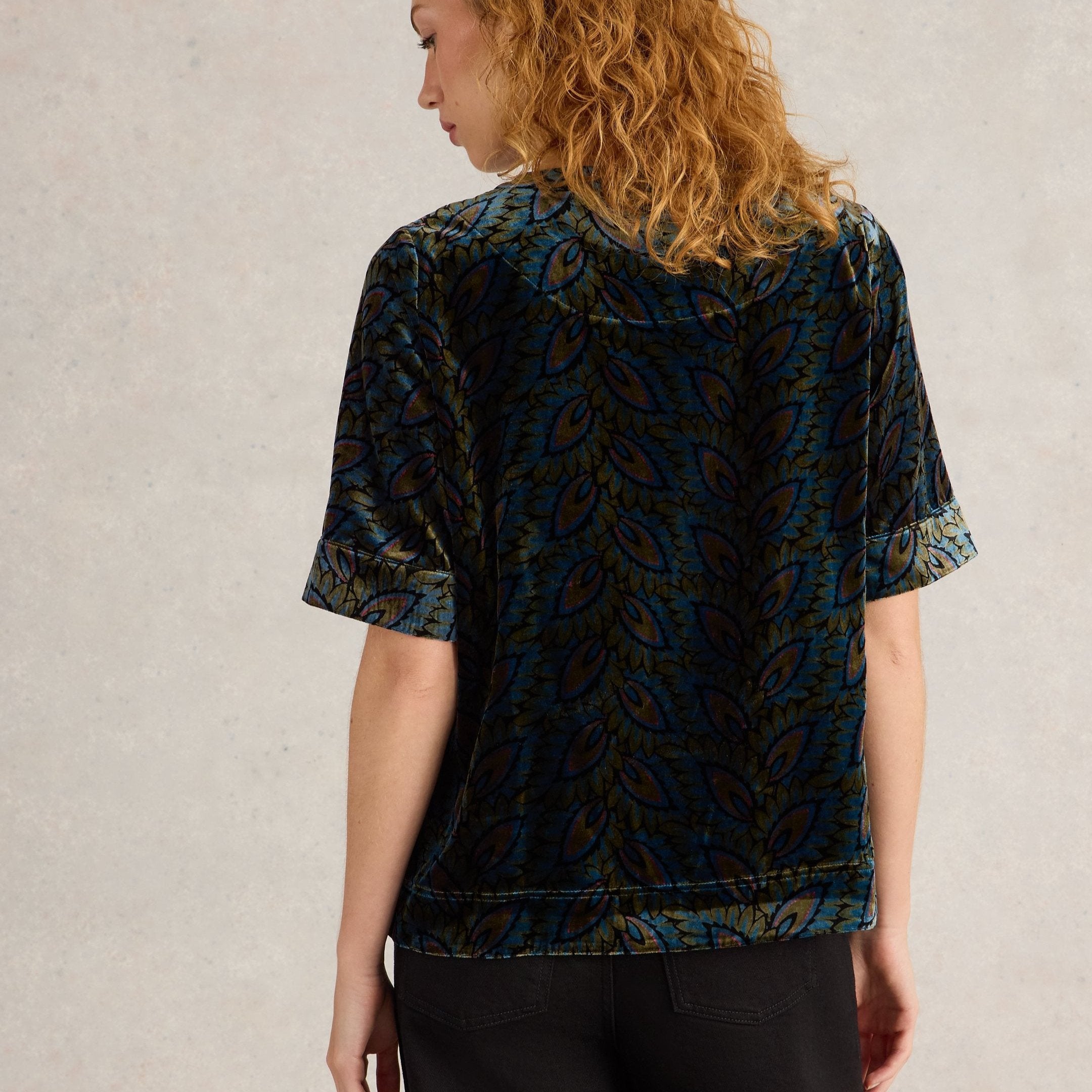 Dark teal velvet short-sleeved top with a teal, olive, and burgundy paisley pattern.