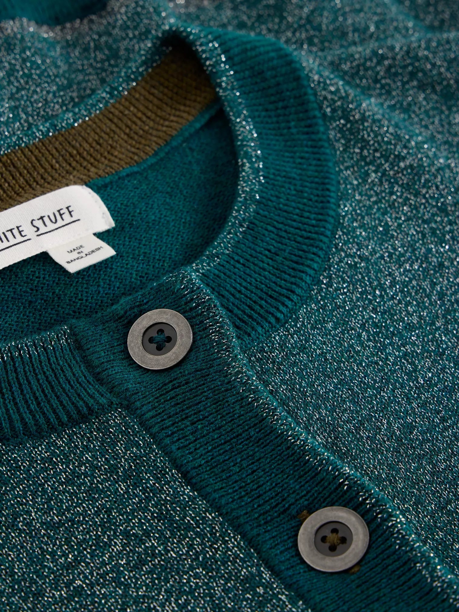 Teal sparkly knit cardigan with dark gray buttons and olive green interior neckline.