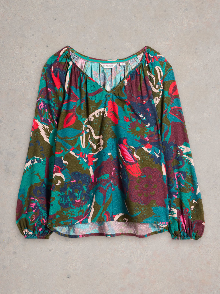 Women's long-sleeve blouse with a V-neck and an abstract floral print in teal, olive, maroon, and pink.