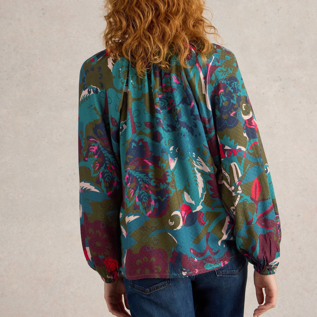 Women's long-sleeve blouse with a teal, olive, and burgundy abstract floral print.