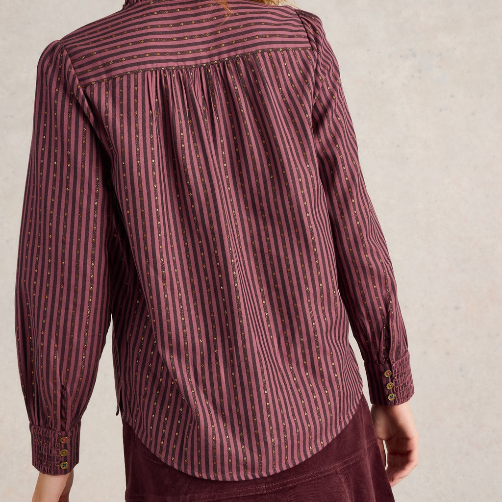 Burgundy striped long-sleeve blouse with gold accents.