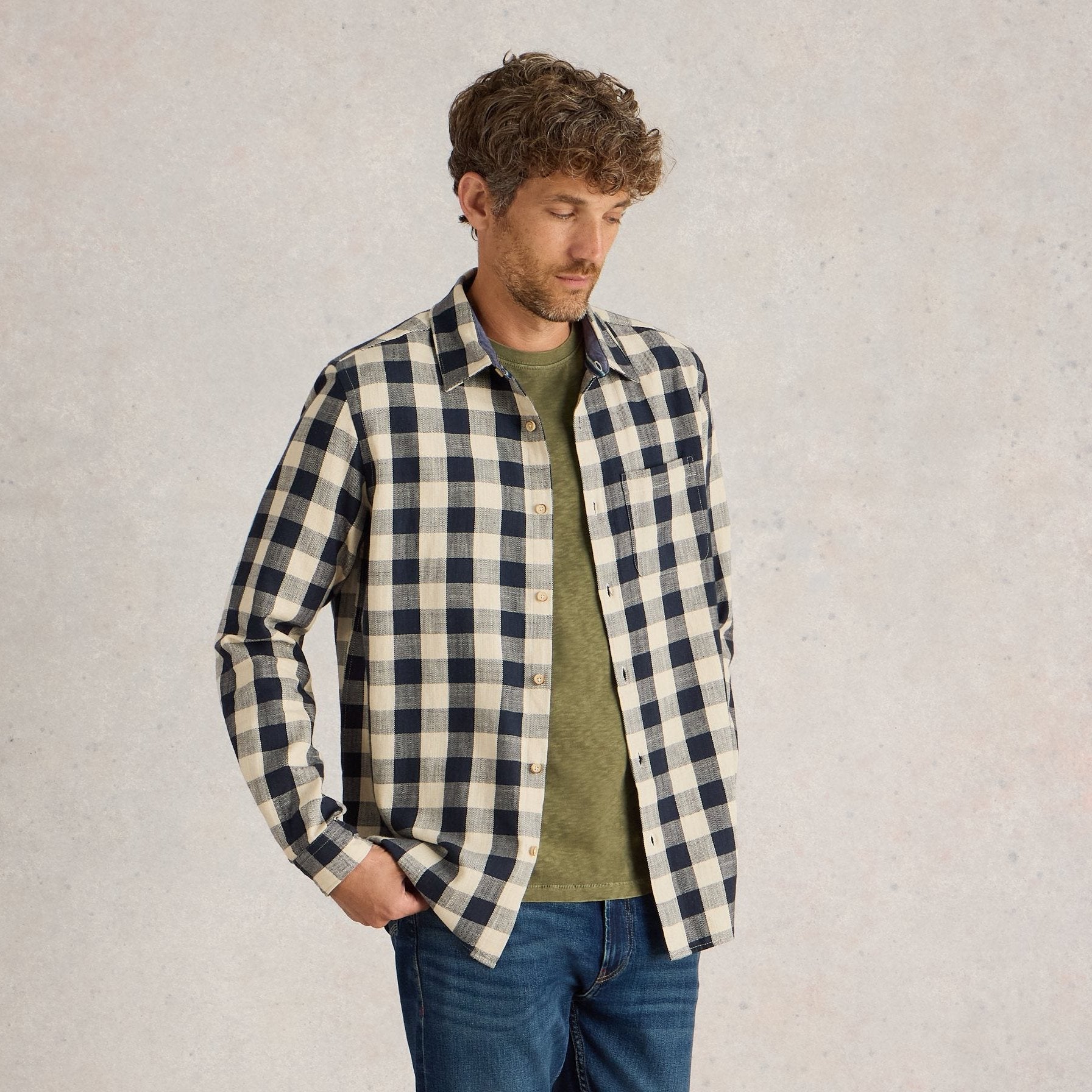 Men's long-sleeve button-down shirt in a cream and navy gingham check pattern.